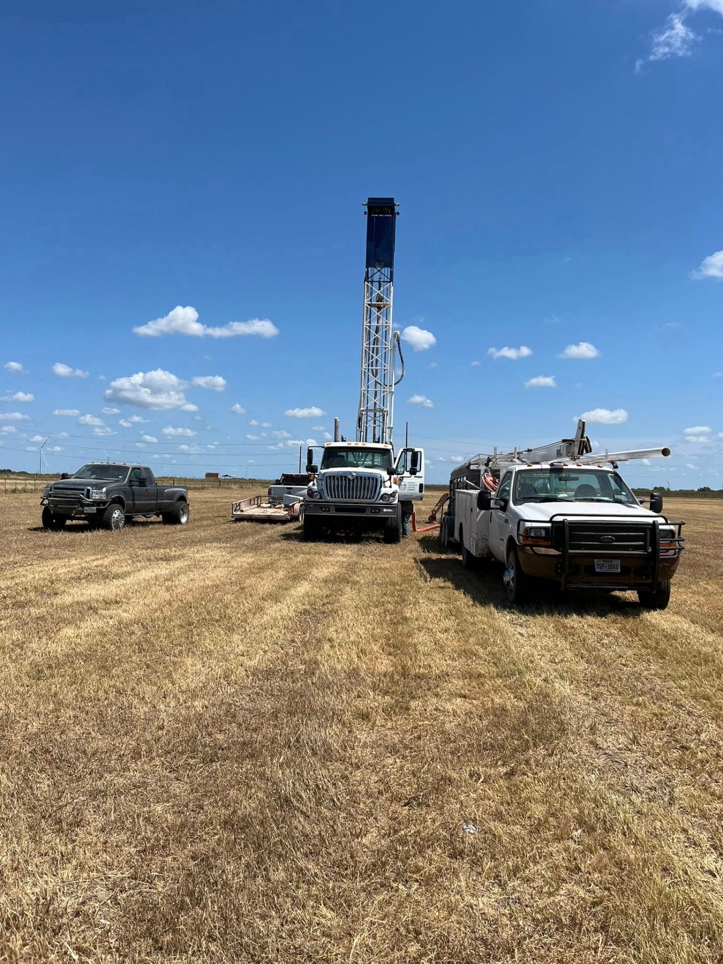 Water well drilling rig at sunset on a South Texas ranch